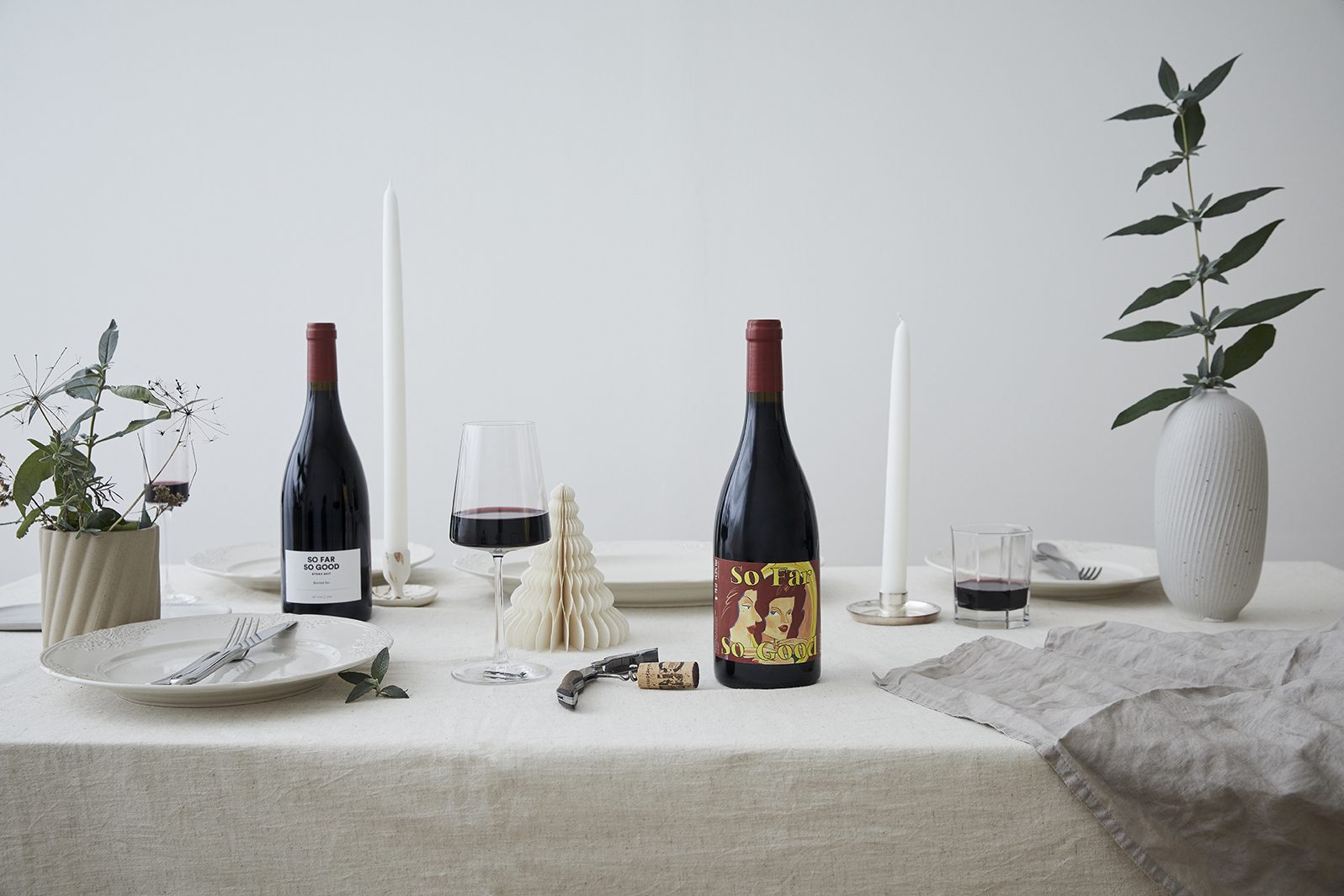 So Far So Good bottles on a set dinner table